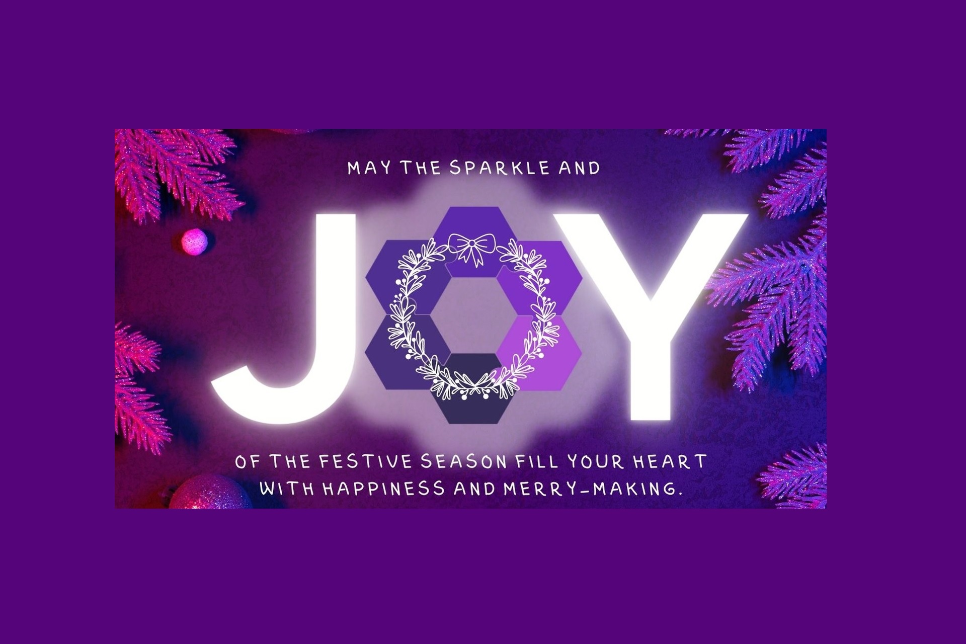 A purple background with baubles and spruce. The message reads May the sparkles and joy of the festive season fill your heart with happiness and merry-making. The word JOY is large and the letter O is made from the Co-POWeR circular logo with a wreath graphic on.